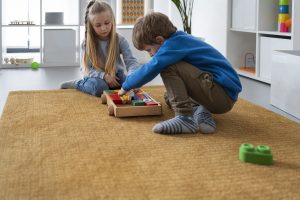 full-shot-kids-playing-with-wooden-toys